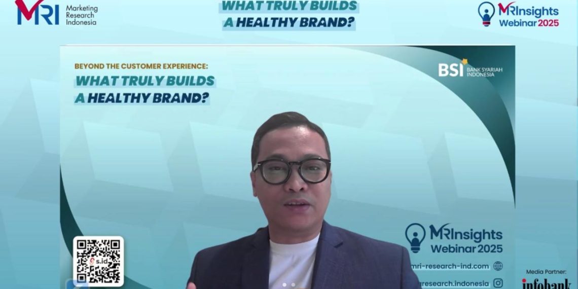 Senior Vice President Marketing Communication Group BSI, Muhammad Arif Gunawan. (Tangkapan layar Zoom: Ayu Utami)