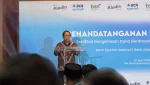 Direktur Utama BSN Alex Sofjan Noor menyampaikan sambutan dalam penandatanganan perjanjian BSN dengan BCA Syariah dan Bank Aladin Syariah di Jakarta, Rabu (22/4/2026). (Foto: Ayu Utami)