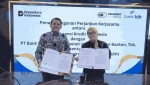 Direktur Bisnis Askrindo, Budhi Novianto (kiri), dan Direktur Operasional Bank BJB, Herfinia usai penandatangan Perjanjian Kerja Sama (PKS) Asuransi Kredit Program Perumahan (KPP). (Foto: Istimewa)